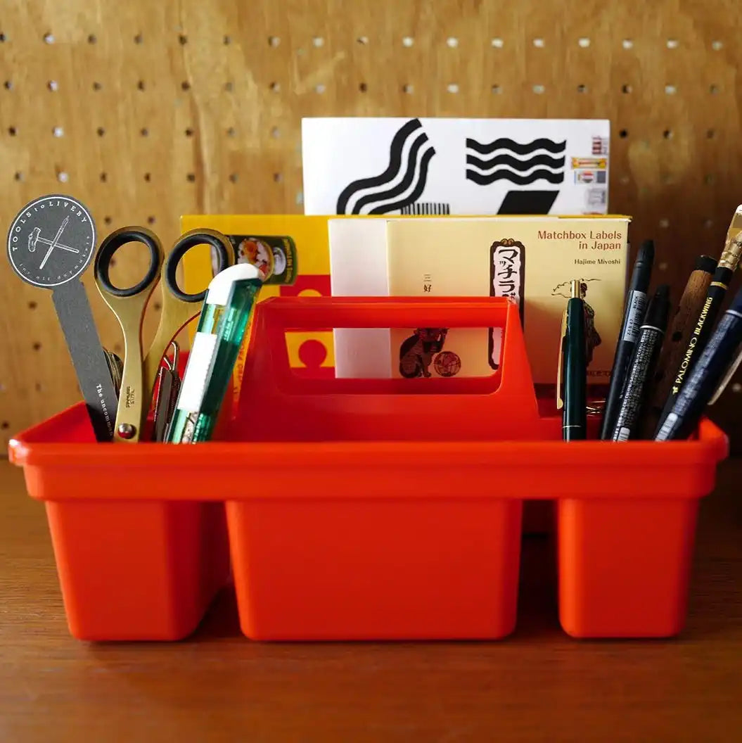 Orange plastic storage caddy.